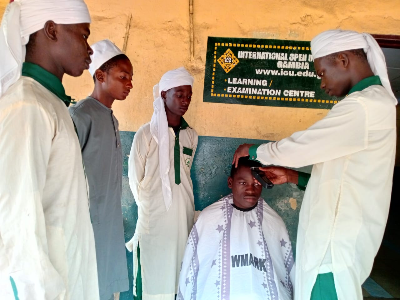 Student practicing barbering on a classmate